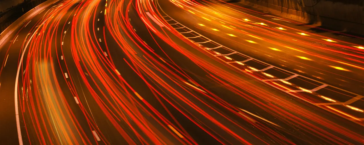 View of a highway with LED lights shooting through the area.