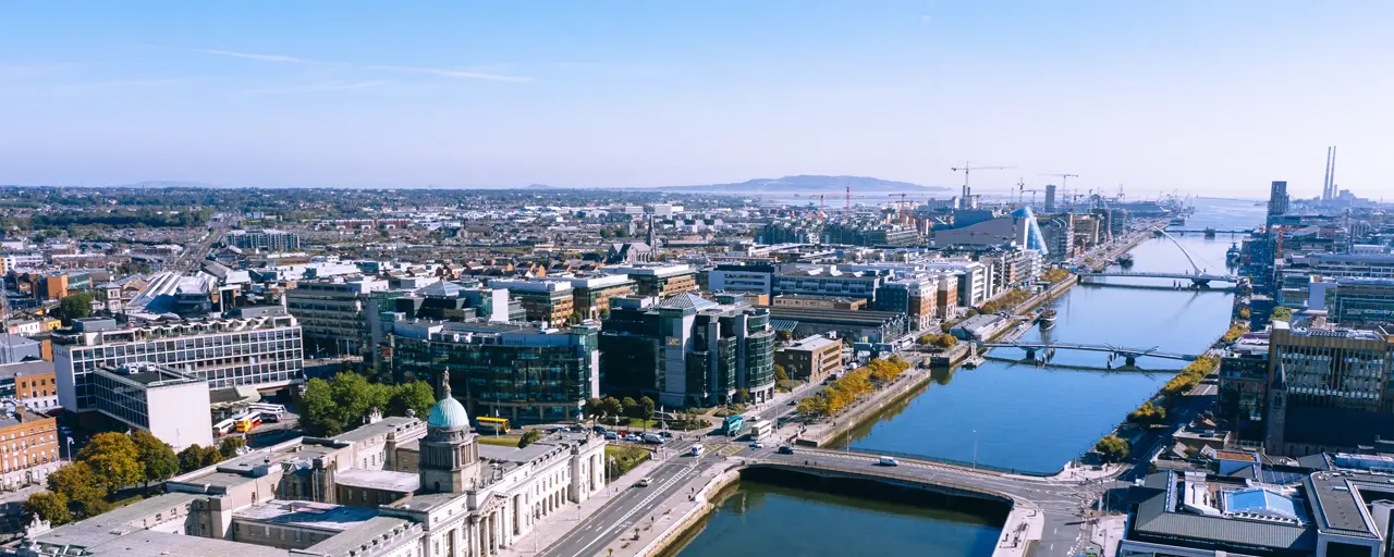 Skyline photo of Dublin along the River Liffey near the Custom House and Talbot Memorial Bridge