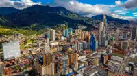 Bogota Cityscape Of Big Buildings And Mountains And Blue Sky