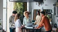 A Group Of Happy Multiethnic Businesspeople Working Together In The Office.