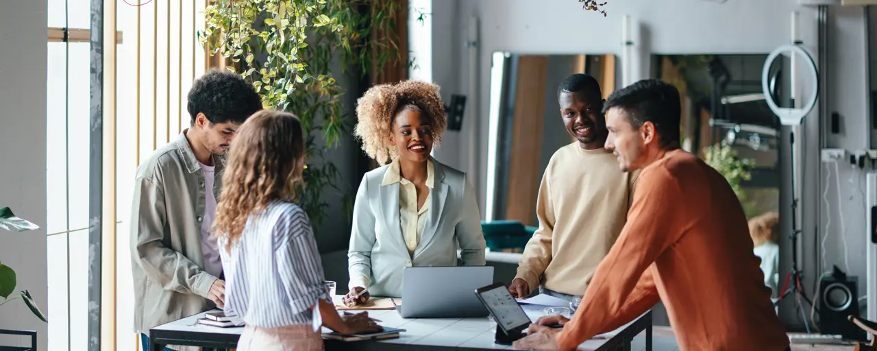 A Group Of Happy Multiethnic Businesspeople Working Together In The Office.