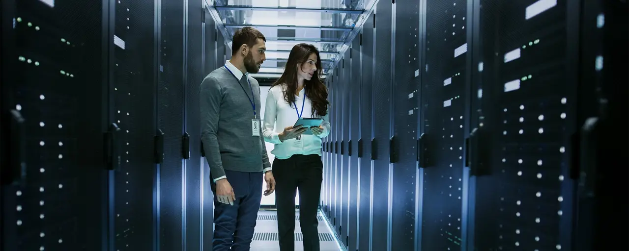 Man and women in data centre office