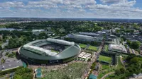 Ariel photo of stadium surrounded by grass and trees.