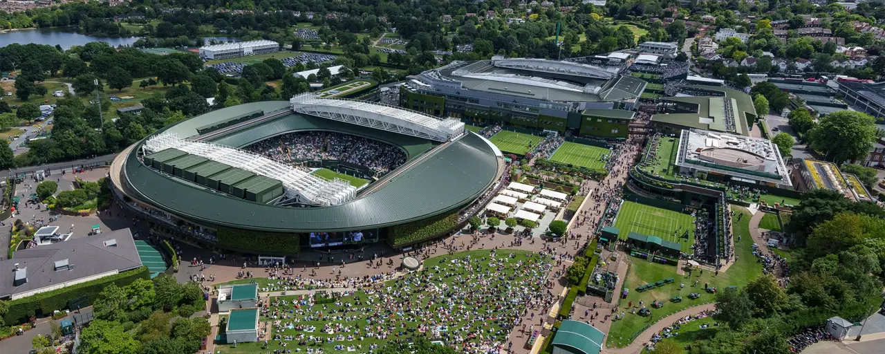 Ariel photo of stadium surrounded by grass and trees.