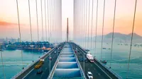 Drone view of Stonecutters Bridge and the Tsing sha highway at sunset.