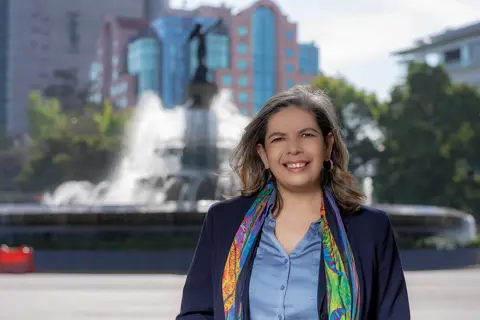 Portrait of Jacquelina Dankfort, Country Manager, Mexico and Business Generation Lead, Latin America, outside in front of a water sculpture