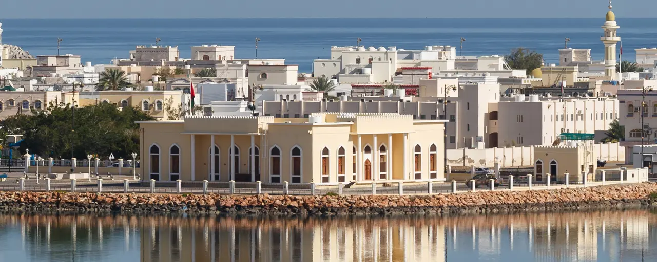 Across the water shot of Oman Refineries and Petro Chemicals (ORPIC) against a blue sky