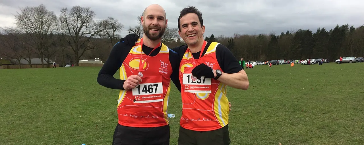 Two men in sports gear posing