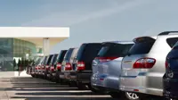 Cars parked up in a row in a car park, showing the back of the car.