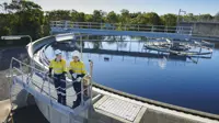 Water infrastructure and two men wearing high vis