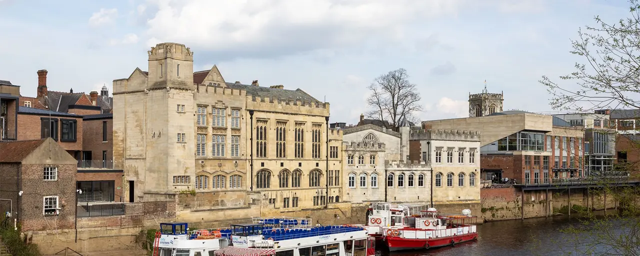 External shot of The Guildhall and the adjacent River Ouse in the UK